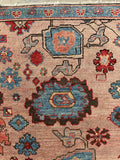 Northwest Persia rug featuring uneven mirrored design and symbols.
