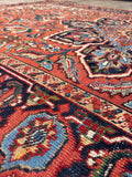 Vintage Heriz rug close-up highlighting gentle authentic wear, soft patina, and crisp pattern lines.