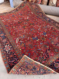 A one-of-a-kind antique hand-knotted Persian Heriz rug.