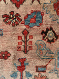 Close-up of angular and playful composition on Heriz rug from the 1970s.