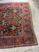 Another view of one end of Persian Bidjar rug laid out.