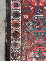 Tribal runner with ivory border decorated in love and unity motifs.