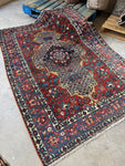 Diagonal view of Bakhtiari rug with intricate layout.
