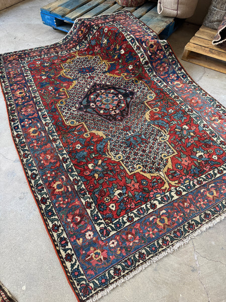 Diagonal view of Bakhtiari rug with intricate layout.