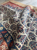 Paisley motifs on an ivory ground.