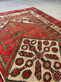 Vintage vegetable dyed wool Serab runner with brick red ground.