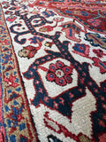 1920s Persian Heriz rug with lustrous wool and room-defining presence.