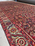 Close-up of serrated leaf and floral border on Karabagh rug