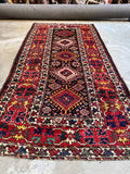 View of Kazak runner showing alternating medallion patterns.