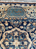 Signed border detail on 1920s Persian Kerman rug.