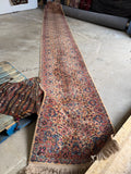 Extra long Karastan Kerman runner measuring 21 ft 5 in by 35 in with floral design on ivory ground.