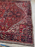 Large Persian area rug. Antique 1920s Heriz carpet with geometric tribal motifs, saturated vegetable dyes, and exceptional full-pile condition.