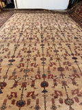 Sultanabad Persian rug displaying scattered geometric blossoms connected by wandering vines.