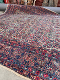 Allover pattern overview of the 8'9 x 11'9 antique rug highlighting its balanced composition.