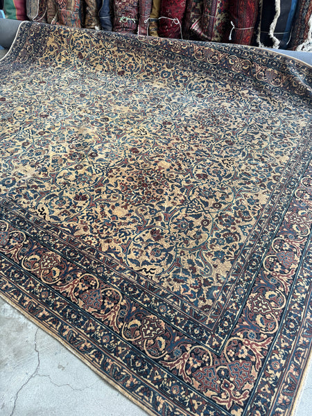 Diagonal shot capturing the full layout of the rug's intricate pattern.