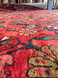 Vintage hand-knotted Persian rug with a durable wool pile and gentle antique patina.
