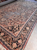 Large 11x17 area rug illuminated by natural daylight showing soft overall palette.