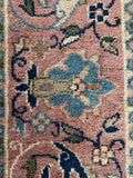 Close up of border band on antique Turkish Sparta rug in oversized format with glowing wool and classic floral artistry.