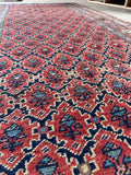 Lattice design Bidjar rug with intricate floral details.