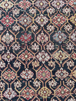Lattice pattern antique Caucasian rug with alternating color motifs.