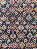 Lattice pattern antique Caucasian rug with alternating color motifs.