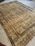 Warm overall tones in handwoven 1880s Kerman rug.