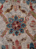 Close up of a wide antique carpet runner offering a distinctive profile and rich, antique warmth.