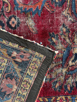 Underside of rug revealing wool weaving technique.