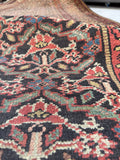 Antique Persian Bakhtiari hallway rug, long vintage wool runner with subtle ombré color shifts, tribal motifs, and beautifully aged patina.