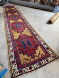 Long antique hallway runner rug. Camel gold tribal Persian wool. 1920s.