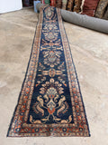 Antique Lilihan Persian runner measuring 2’9 x 14’2 featuring a deep navy blue background and delicate floral patterns.