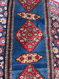 1940s Persian runner rug with vegetable-dyed wool and repeating geometric design.