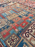 Blue antique tribal runner rug with mountain edge border design measuring 3 foot 4 inches by 8 foot.