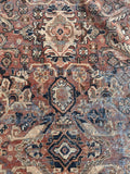 1930s Persian Mahal rug central medallion detail with intricate surrounding geometric blossoms.