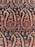 Close up view of colorful paisley layout on narrow rug.