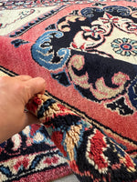 Persian rug with midnight blue and lake blue accents on a soft pile.