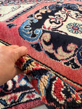 Persian rug with midnight blue and lake blue accents on a soft pile.