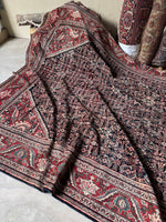 Decorative border of Persian rug with serrated leaves on red ground