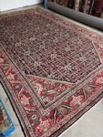 Vintage Persian Mahal rug with tight Herati motif grid on charcoal background