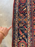 Close-up of secured patch along rug’s side edge.
