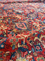 Ornate botanical motifs throughout Persian Mahal rug.