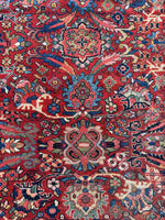 Close-up of small and large botanical motifs on a Mahal rug.