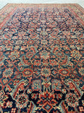 Detail of repeating Herati fish design on antique Persian rug.