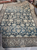 Large village-woven Malayer rug showing overall floral pattern.