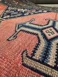 Close-up view of weave and vegetable dyed wool in an antique Persian Malayer rug.