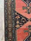 Border bands with geometric patterns on antique Malayer runner.