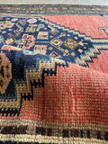 Handwoven Malayer runner showing vegetable dyed wool and low pile.