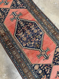 Early 1900s Malayer rug with negative space design and crisp geometry.