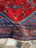 Border close-up showing floral and geometric motifs.