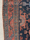 Close up of border band detail on antique tribal Malayer rug with rich aged dyes.